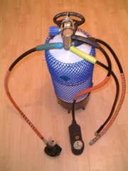 A "single-hose" aqualung with the first stage on top of the cylinder and the second stage demand valve on the left hand hose