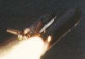 Photograph of the 51-L launch at approximately 58.82 seconds after launch shows an unusual plume in the lower part of the right hand SRB.