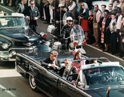 The Presidential limousine before the assassination. Jacqueline is in the backseat to the President's left.