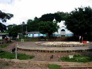 The town square in El Mozote. The church was recently rebuilt in 2000 next to the remains of the one burned down.