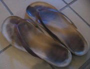 A pair of well-used flip-flops