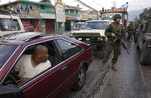 U.S. Marines patrol the streets of Port-au-Prince on March 9, 2004.