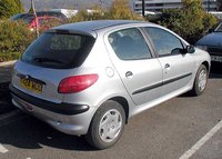 The rear of a silver  Peugeot 206