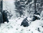 American soldiers taking up defensive positions in the Ardennes during the Battle of the Bulge.