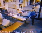 Atta (blue shirt) and al-Omari in the  airport on the morning of 9/11. Note that this is a non-hijacked flight.