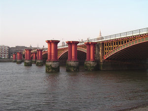 Blackfriars Railway Bridge, London, with remains of old bridge in foreground