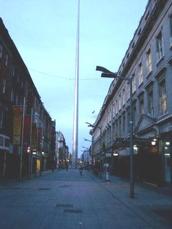 The view from Henry Street at dusk. Though perfectly upright its size in relation to neighbouring buildings gives the illusion that it is leaning to one side.