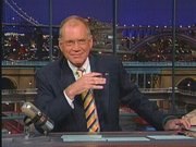 Letterman behind the desk at The Late Show.