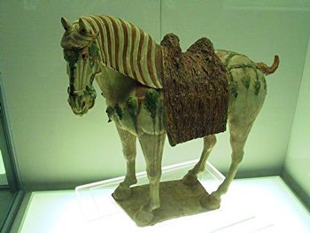 A classic tri-color  Tang Dynasty horse, using yellow, green and white colors, from the Shanghai Art Museum