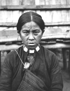 An  tribal lady with tattoo on her face as a symbol of maturity, which was a tradition for both males and females. The custom was prohibited by the authority during the Japanese rule.