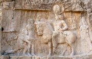 Valerian defeated kneels in front of Shapur
