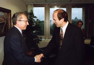 Handshake between Slovenian Prime Minister , on the right, and Jacques Delors