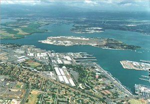  Aerial view of Pearl Harbor, Ford Island in center. The Arizona memorial is the small white speck on the far right side close to Ford Island