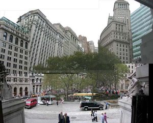 Bowling Green, shown in a composite photograph taken from the steps of the U.S. Custom House looking north along Broadway.