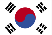 The flag of South Korea, with tijt in the center with four trigrams representing earth, air, fire, and water.