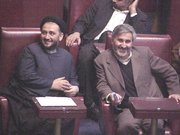 Mohammad Ali Abtahi (left) sitting with  in the parliament