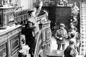 Antonio Tejero with a gun in his hand, breaking into the Congress of Deputies February 23, 1981, attempting a coup. Below to the right is the defence minister Manuel Gutirrez Mellado