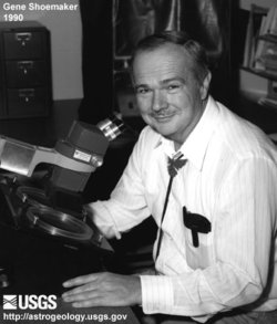 Eugene Shoemaker at a stereoscopic microscope used for asteroid discovery