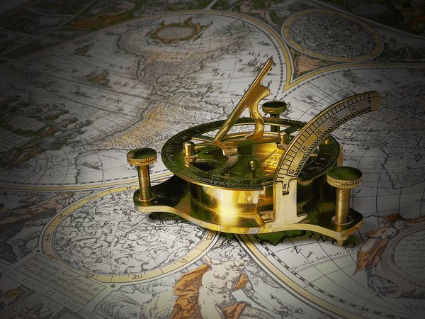 Gold sundial on a map