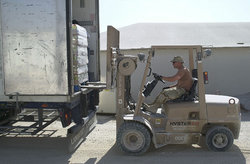 US airman operates forklift at a truck