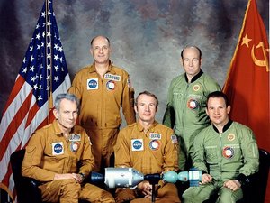 Brand (seated center) poses with the rest of the American and Soviet crew of Apollo-Soyuz