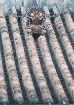 Shisa on a traditional tile roof