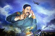Saddam Hussein in a  picture overseeing a war scene in the foreground