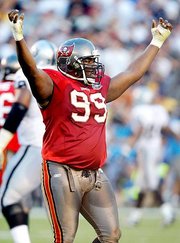 Warren Sapp celebrating a big play while playing with Tampa Bay