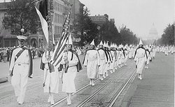 Ku Klux Klan members march down Pennsylvania Avenue in Washington, DC in 1928.