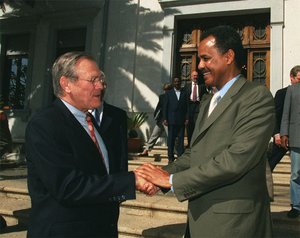 U.S. Secretary of Defense Donald Rumsfeld and Eritrean President Isaias Afewerki shake hands in Eritrea