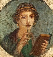 So-called , fourth style fresco; Pompeii, Region VI, Insula occidentalis. A young woman is shown with a pen that is used to enscribe writing on the wax tablets she is holding. The net in her hair is made of golden threads and typical for the fashion of the Neronian period.