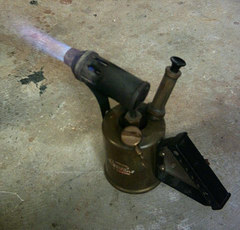 A kerosene blowtorch displaying the various aspects of the kerosene burner