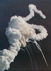 Main engine exhaust, solid rocket booster plume and an expanding ball of gas from the external tank is visible seconds after the explosion.