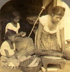 Traditional tortilla making. The mother grinds the maize with a stone mano and metate as the elder daughter pats the dough into tortillas.  (, c. )