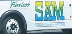 The logo for the SAM service is seen on the side of one of its busses