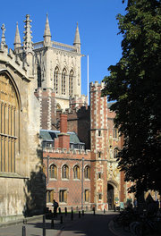 Trinity Street and the Main Gate of  with the tower of college's chapel looming in the background.