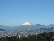 The Cotopaxi volcano looms 50 km south of Quito.
