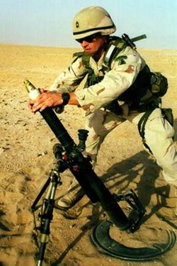 A soldier firing the M224