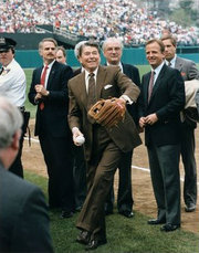 Ueberroth (front right) watches President Ronald Reagan throw the first pitch prior to a game