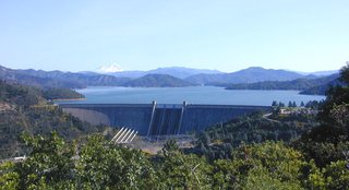 Shasta dam with Shasta Lake behind it and  in the distance