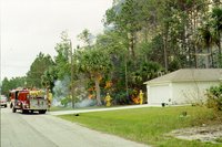 Firefighters at an urban—wildfire interface. This is becoming an increasing concern as people build more homes in and near forested land.