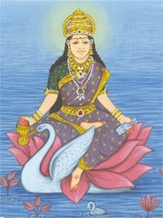 Goddess Gayatri, holding a book in one hand and a cure in the other, sitting on a lotus flower and accompanied by a swan