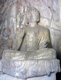 Tang Dynasty Amitabha sculpture. Hidden Stream Temple Cave, Longmen Grottoes, China.