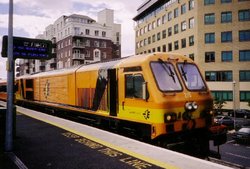 One of the 34 GM locomotives bought in the ,  locomotive 215 "River Avonmore - An Abhainn Mhor", sits at Grand Canal Dock  station.