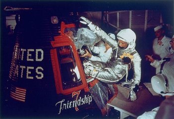 John Glenn, Jr., as he enters into the spacecraft (NASA)