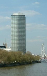 Millbank Tower from the south, taken from Vauxhall bridge. The London Eye is to the right.