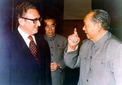 Kissinger, shown here with Zhou Enlai and , negotiated the normalization of relations with the People's Republic of China.