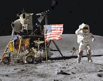 John Young jumps while saluting the flag. (NASA)