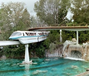Monorail Blue travels over the Submarine Voyage lagoon in Tomorrowland.