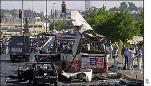 The wreckage of a commuter bus in West Jerusalem after a suicide bombing on Tuesday,  . The blast killed 20 people.